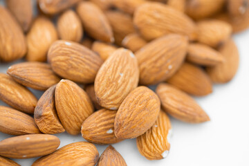 Almond nuts on isolated white background