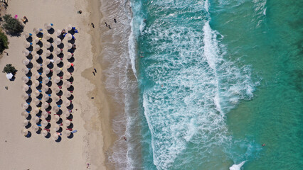 Aerial drone photo of famous bay and organised sandy beach of Livadi Armenistis, popular for surfing sports, Ikaria island, Northeast Aegean, Greece