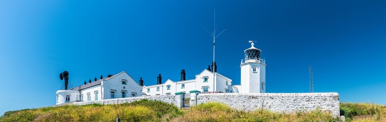 Fototapeta na wymiar Lizard Lighthouse and Housel Bay Cliffs, Lizard, Helston, Cornwall, England