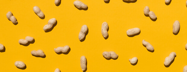 Group of peanuts isolated on yellow background