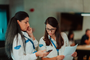 Group of female security operators working in a data system control room Technical Operators...