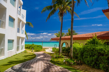 Luxury white villa with palms in Playa del Carmen, Yukatan, Mexico