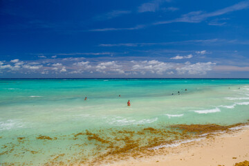 Sandy beach on a sunny day with hotels in Playa del Carmen, Mexico