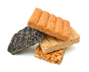Honey bars with peanuts, sesame and sunflower seeds isolated