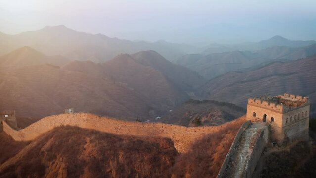 Aerial shot of the Great Wall of China at sunrise.