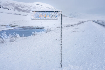 Traffic sign under snow