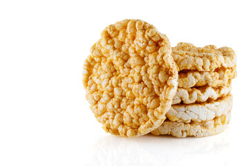 Caramelized corn cakes. Puffed whole grain crispbread isolated on white background. Close-up.