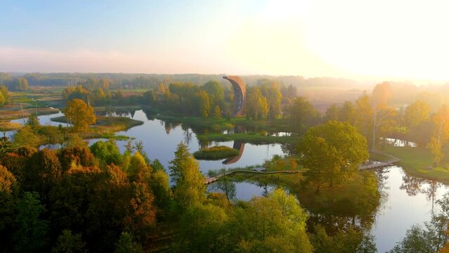 Aerial view of Kirkilai karst lakes and lookout tower in the sunny fall morning