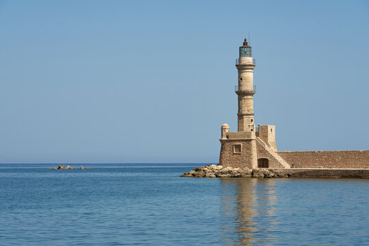 An ancient lighthouse in the port of Chania on the island of Crete