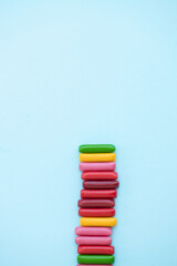 Candy colored sticks on blue background