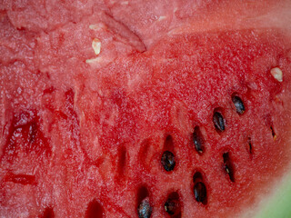 Background from the pulp of watermelon. Watermelon in a cut. Berry pulp. Juicy square. Red fruit. Quench thirst
