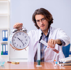 Chemistry lecturer during lecture in college