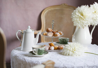 tea break in english style, vintage still life, homemade buns, a bouquet dalias