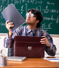 Funny male math teacher in the classroom