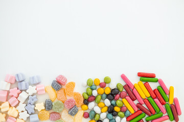 many different candies, sweets on white background