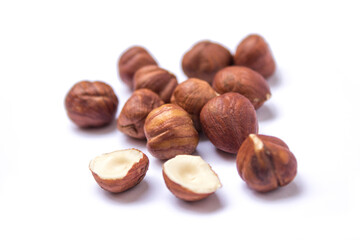 hazelnuts lie on a white background