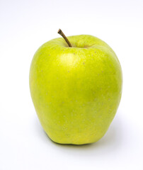 green apple lies on a white background