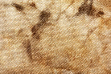 Old fabric with brown stains full frame for background, murder case idea, old blood stains on fabric,cream brown abstract