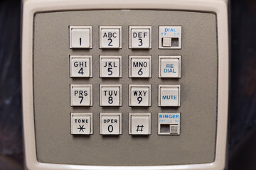 Close-up of a beige telephone keypad