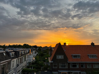 Picturesque view of city street with beautiful buildings at sunrise