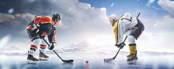Hockey concept. Two professional hockey players start the game in ice. Fight for the puck. Sports...