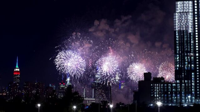 Magnificent fireworks over New York at Independence day, 4th of July. View Manhattan view from Queens borough, Empire State building is on the left 