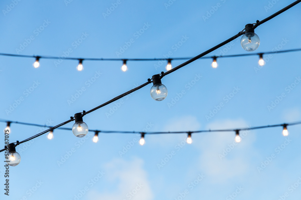 Sticker Street garlands of light bulbs hanging on black wires