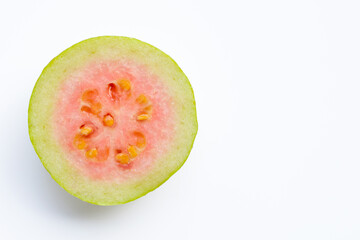 Half pink guava on white
