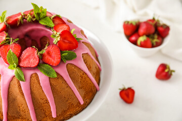 Tasty cake with strawberry on light table, closeup