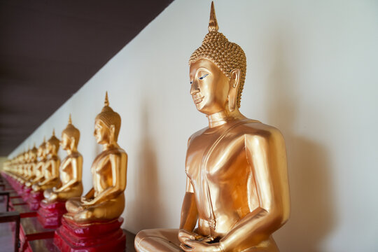 golden buddha statue - Powered by Adobe
