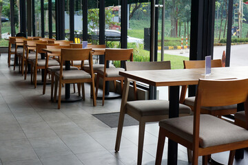 Interior of a cafe with lots of windows and glass doors                     