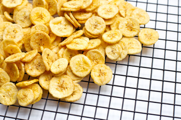 Banana slice chips on white background.