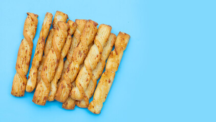 Bread sticks on blue background
