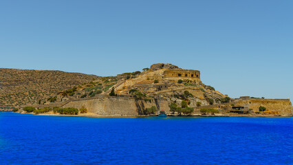 The island of lepers (Spinalonga) is an island in southern Greece and the second most visited tourist attraction in Crete .