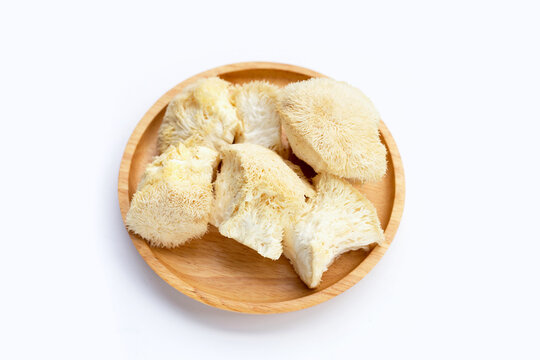 Rare Lion`s Mane Mushroom On Wooden Plate On White Background.