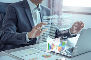Businessman or analyst touching futuristic virtual touchscreen for investing risk analysis and business performance