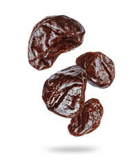 Delicious prunes in the air closeup on a white background