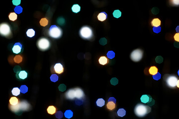 multicolored festive lights on a black background screensaver backdrop