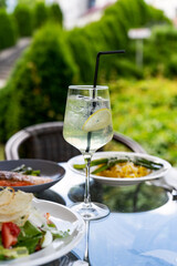 Still life of summer cocktail on dinner table