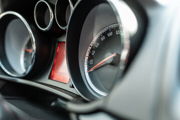 Modern car speedometer,odometer,tachometer and illuminated dashboard. car dashboard modern automobile controlilluminated panel speed display.Car instrument panel.Close up.Selective focus.