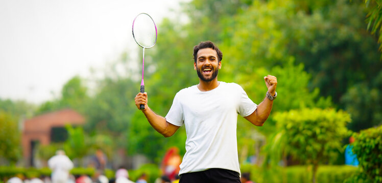 Portrait of badminton player holding badminton racket hd image