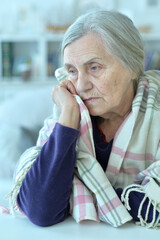 Close up portrait of tired senior woman