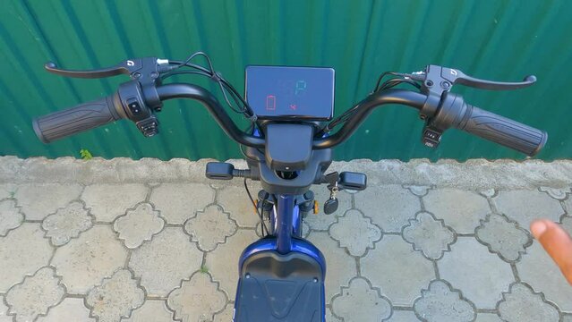 Moment of turning on the ignition e-bike. Turn the key and turning Display