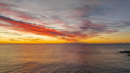 Fototapeta na wymiar Sunrise over the sea with high cloud