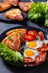 irish breakfast of fried eggs, bacon, potato farls