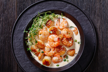 shrimps and scallops in spicy coconut cream sauce