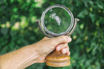 Old mirror in hand close-up