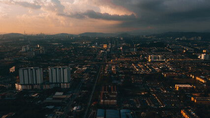 Fototapeta na wymiar Aerial view of the sunset with urban architectures and city. View of the suburban town in Malaysia.