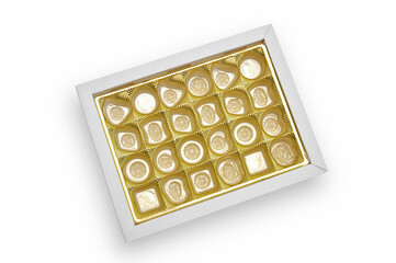Top view of empty candy box on white background. Gold colored tray for candy and confectionery products.