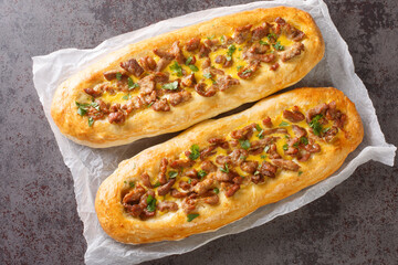 Pastrmalija Macedonian Pizza is a traditional favorite, made with tender chunks of pork, eggs, and...